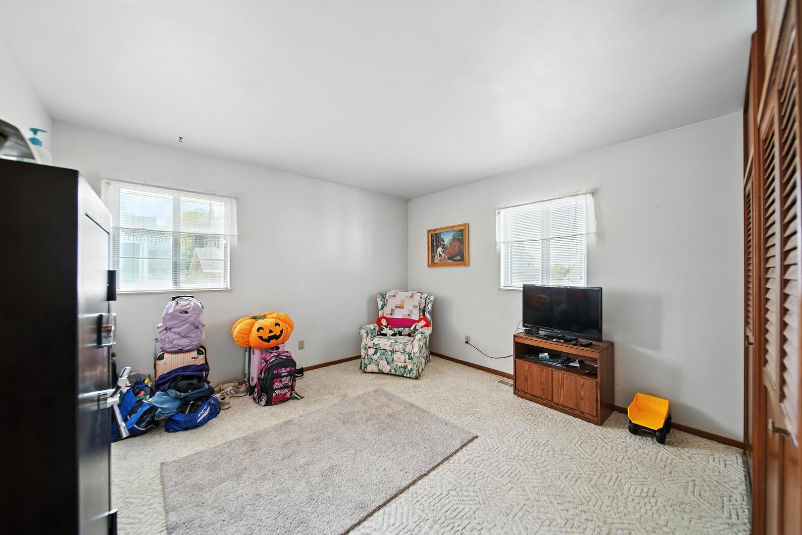 215 East 3rd Street Dixon, IL 61021 - Photo 12 of 16 a view of a room with baby toys and living room