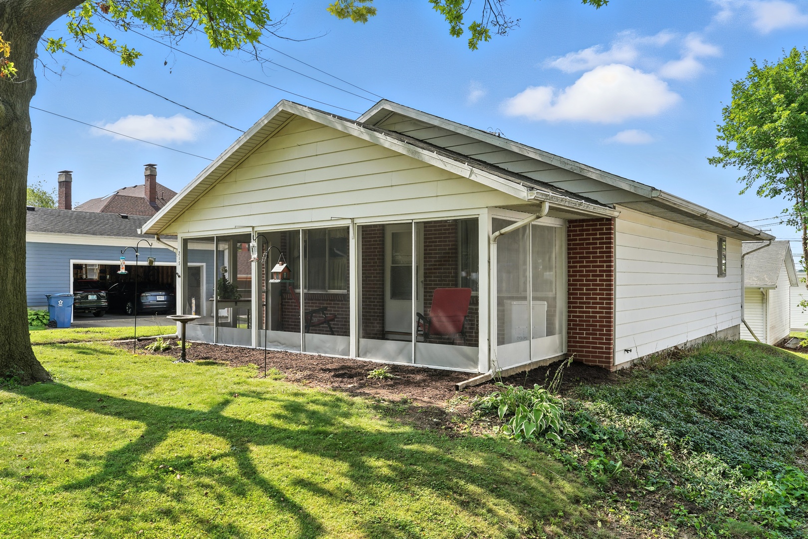 215 East 3rd Street Dixon, IL 61021 - Photo 2 of 16 a view of a house with yard and porch