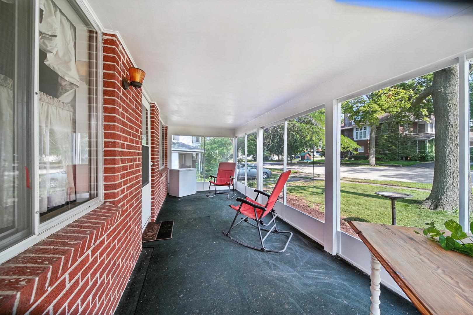 215 East 3rd Street Dixon, IL 61021 - Photo 3 of 16 a view of a two chairs in the balcony