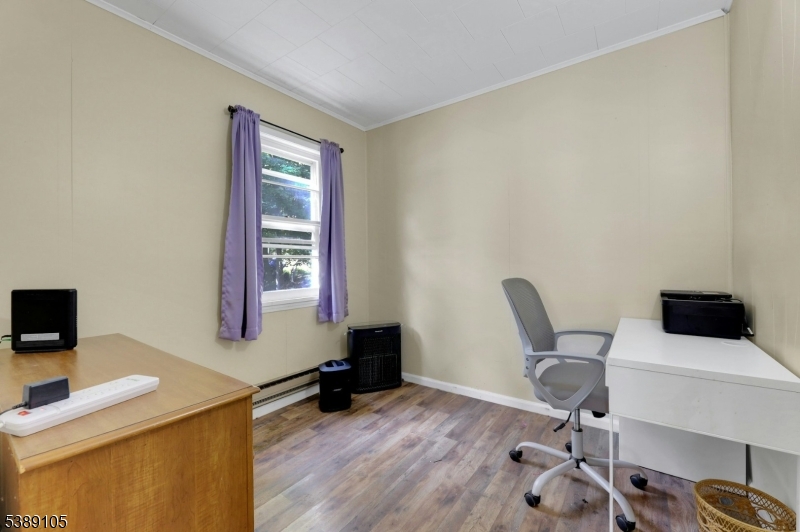28 Risley Road West Milford, NJ 07421 - Photo 16 of 23 a view of a workspace with furniture and a window