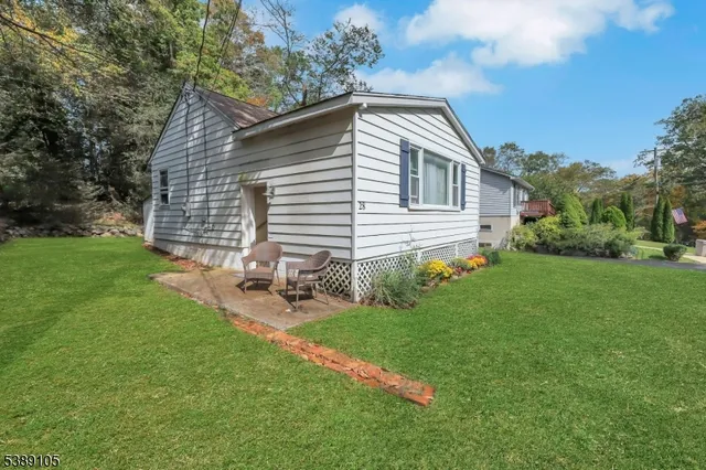 a view of backyard with a garden and entertaining space
