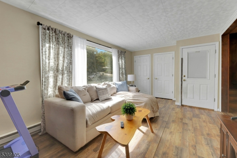 28 Risley Road West Milford, NJ 07421 - Photo 8 of 23 a living room with furniture and a large window