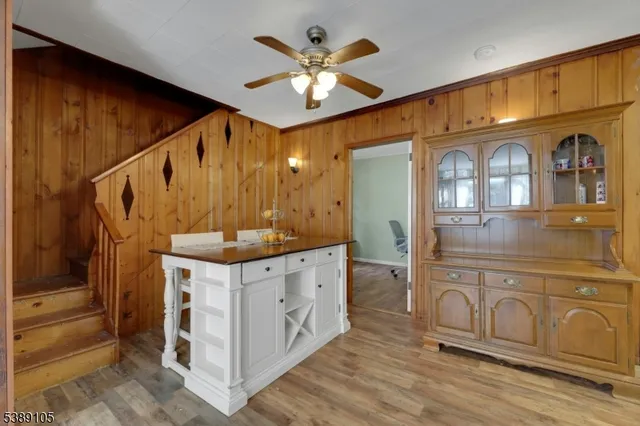 a bathroom with a sink a mirror and a shower