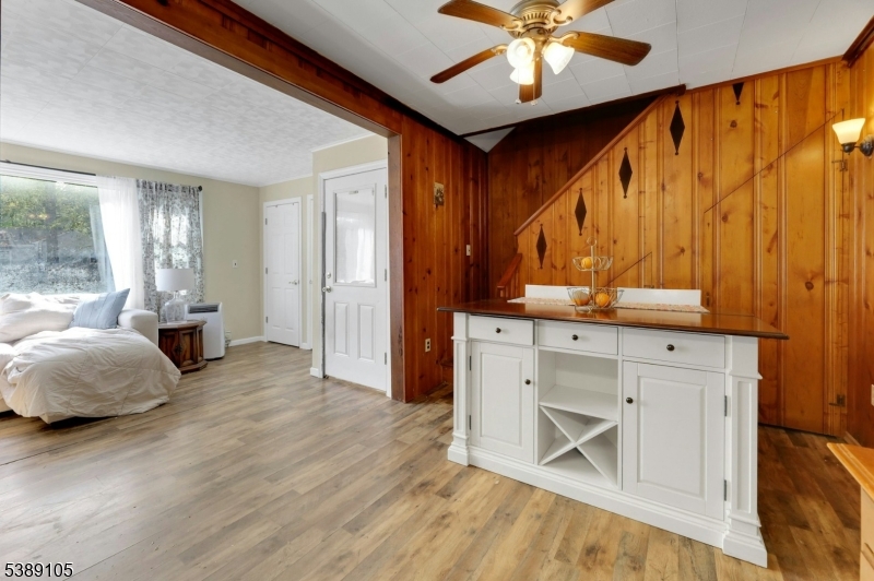 28 Risley Road West Milford, NJ 07421 - Photo 10 of 23 a bedroom with a bed and a chandelier