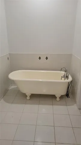 a bathroom with a sink toilet and bathtub