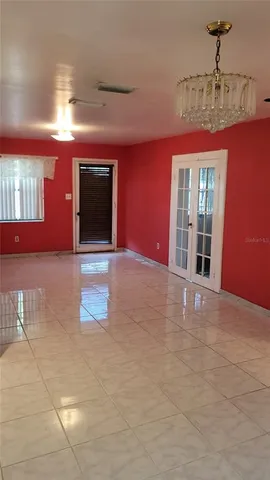 a view of an empty room with glass door