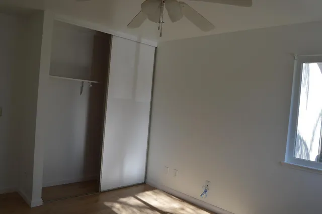 a view of an empty room with a window