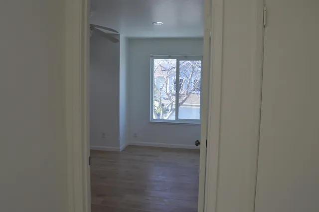 a white toilet sitting next to a bath tub