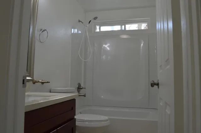 an empty room with a bathroom