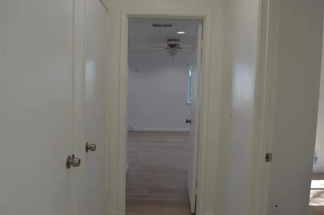 an empty room that has a window in it