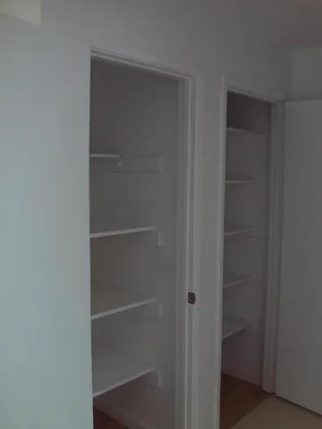 a view of a door and chair in the balcony