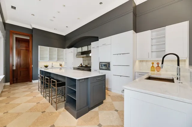 a dining room with furniture and a chandelier