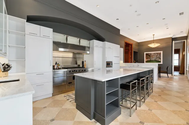 a bedroom with a bed a couch and dresser