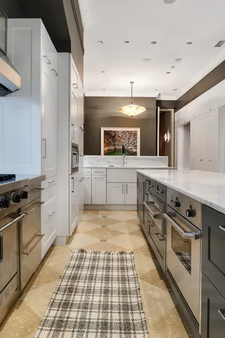 a spacious bedroom with a large bed and a flat screen tv