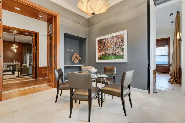 a living room with furniture a rug and a window