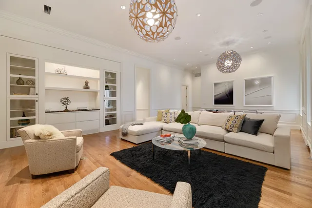 a spacious bathroom with a double vanity sink a mirror and a shower