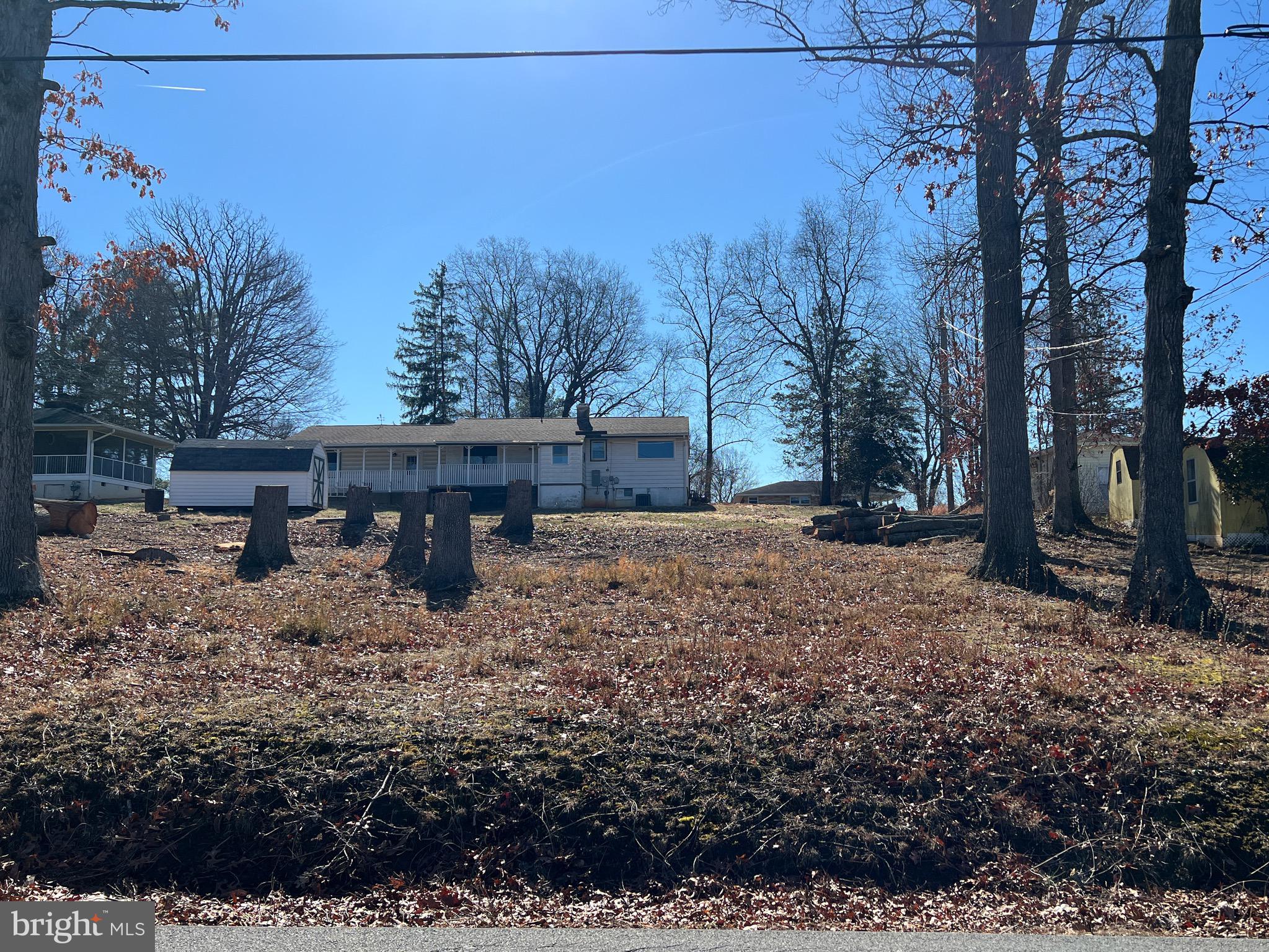 0 Wayland Road Culpeper, VA 22701 - Photo 1 of 2 a view of a backyard with wooden fence and large trees