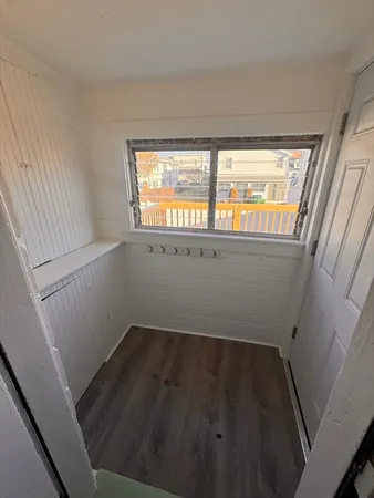 a view of wooden floor and windows in a room