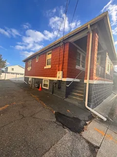 a view of a house with a street