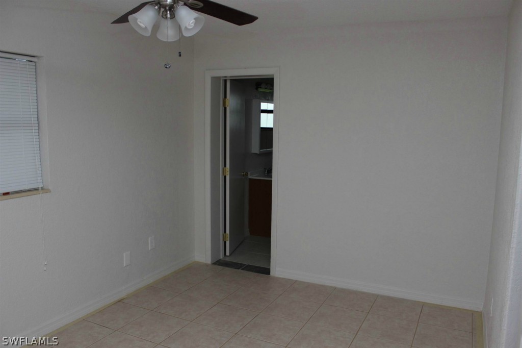 112 Florida Road Lehigh Acres, FL 33936 - Photo 12 of 25 an empty room with a bathroom