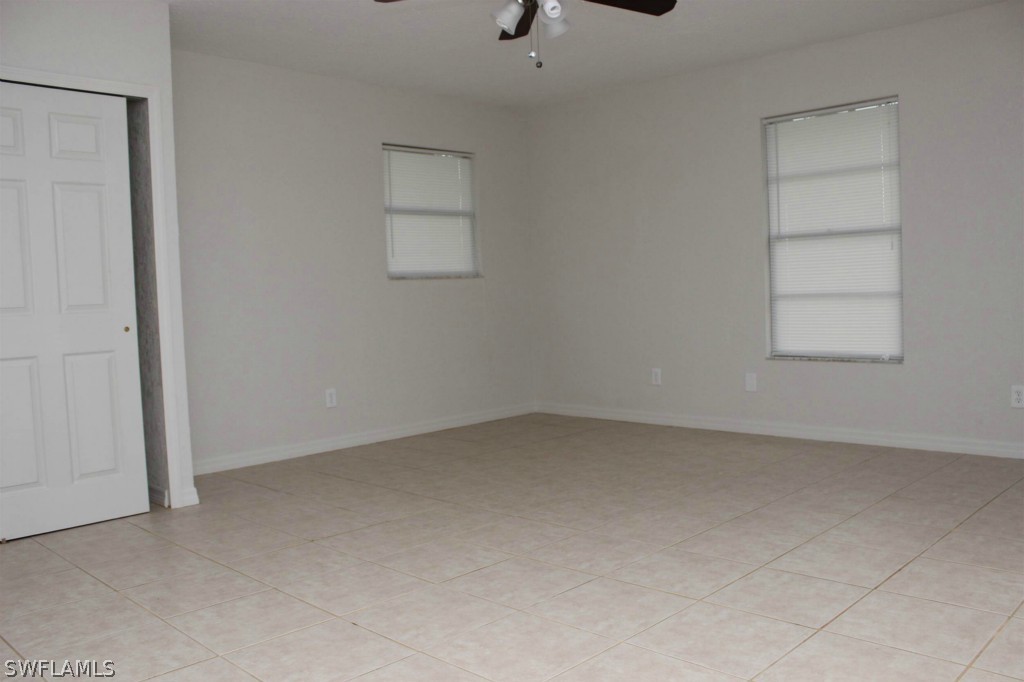 112 Florida Road Lehigh Acres, FL 33936 - Photo 19 of 25 an empty room with windows