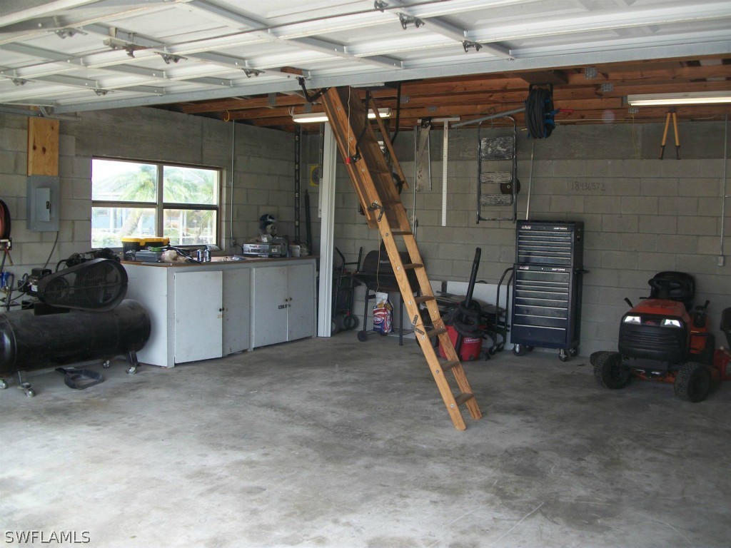 112 Florida Road Lehigh Acres, FL 33936 - Photo 21 of 25 a living room with furniture and a wooden floor