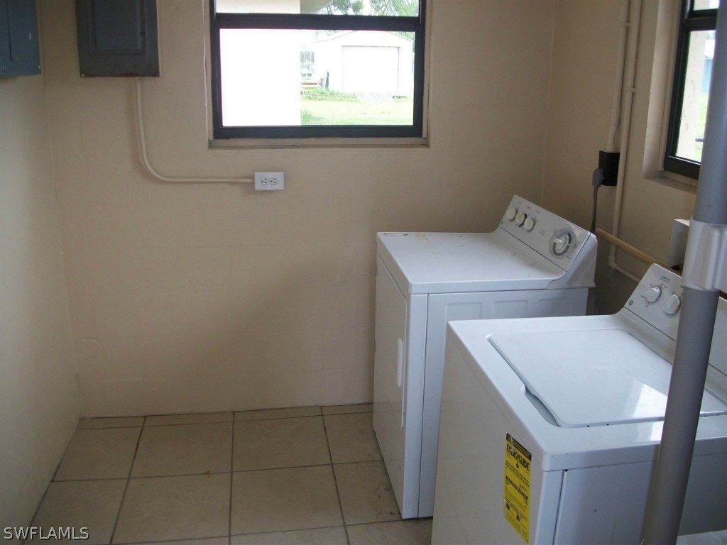 112 Florida Road Lehigh Acres, FL 33936 - Photo 25 of 25 a utility room with dryer and washer