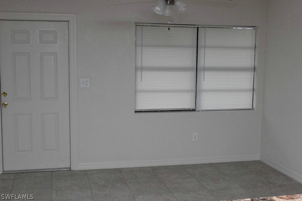 112 Florida Road Lehigh Acres, FL 33936 - Photo 7 of 25 a view of an empty walk in closet