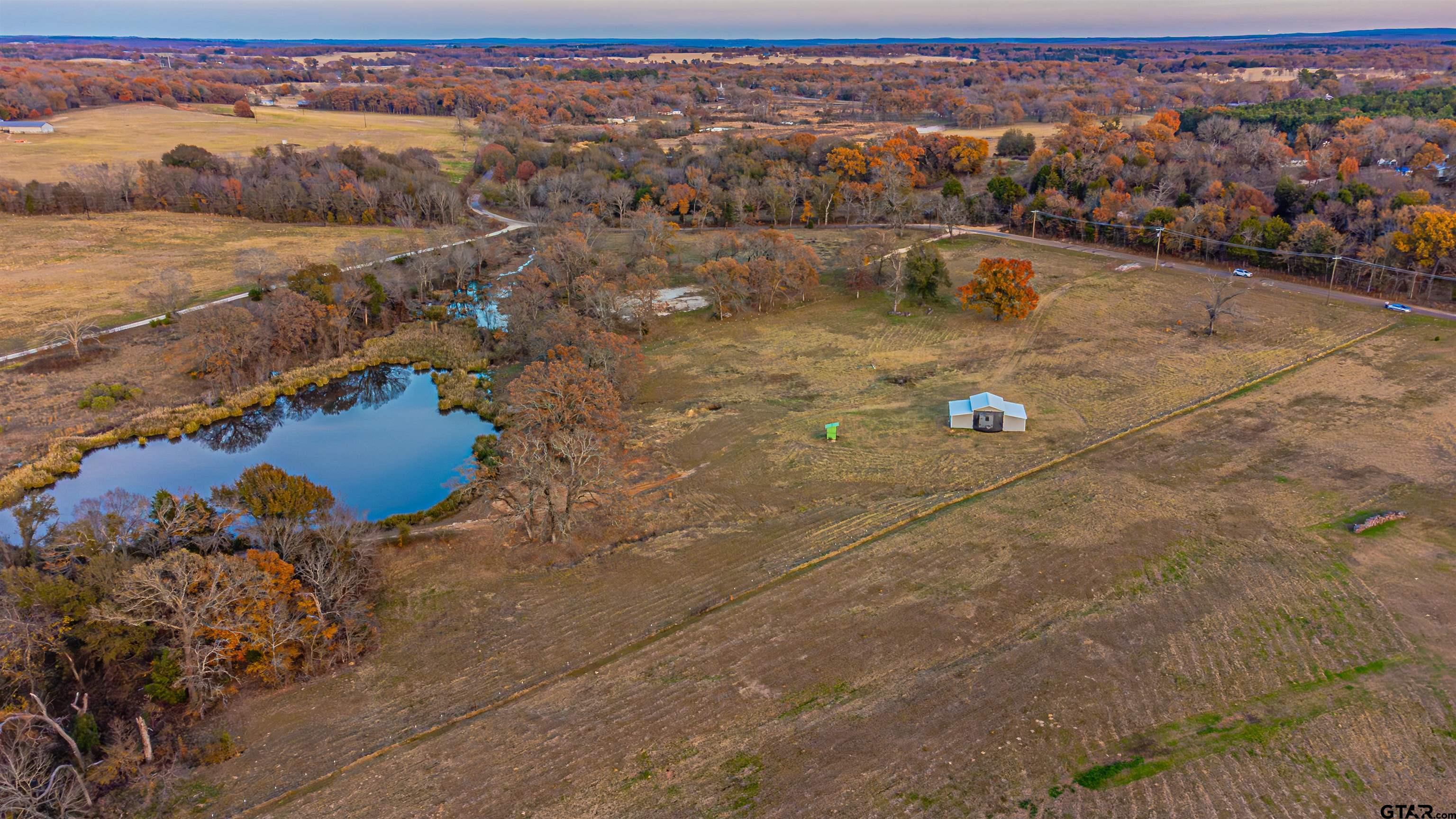 9244 County Road 1200 Athens, TX 75751 - Photo 11 of 15 an aerial view of residential houses with outdoor space