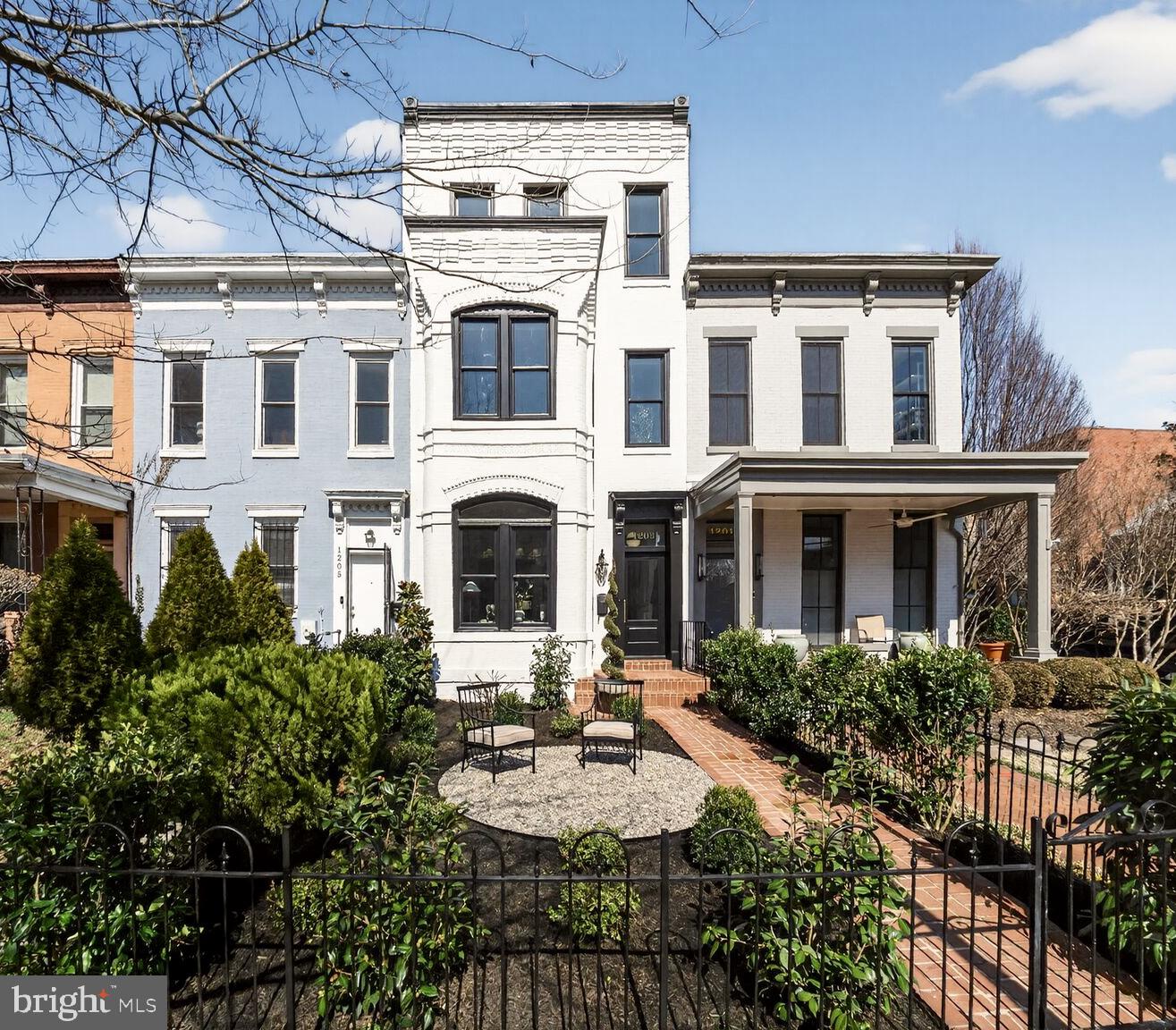 1203 T Street Northwest Washington, DC 20009 - Photo 1 of 46 a front view of a building with garden and porch