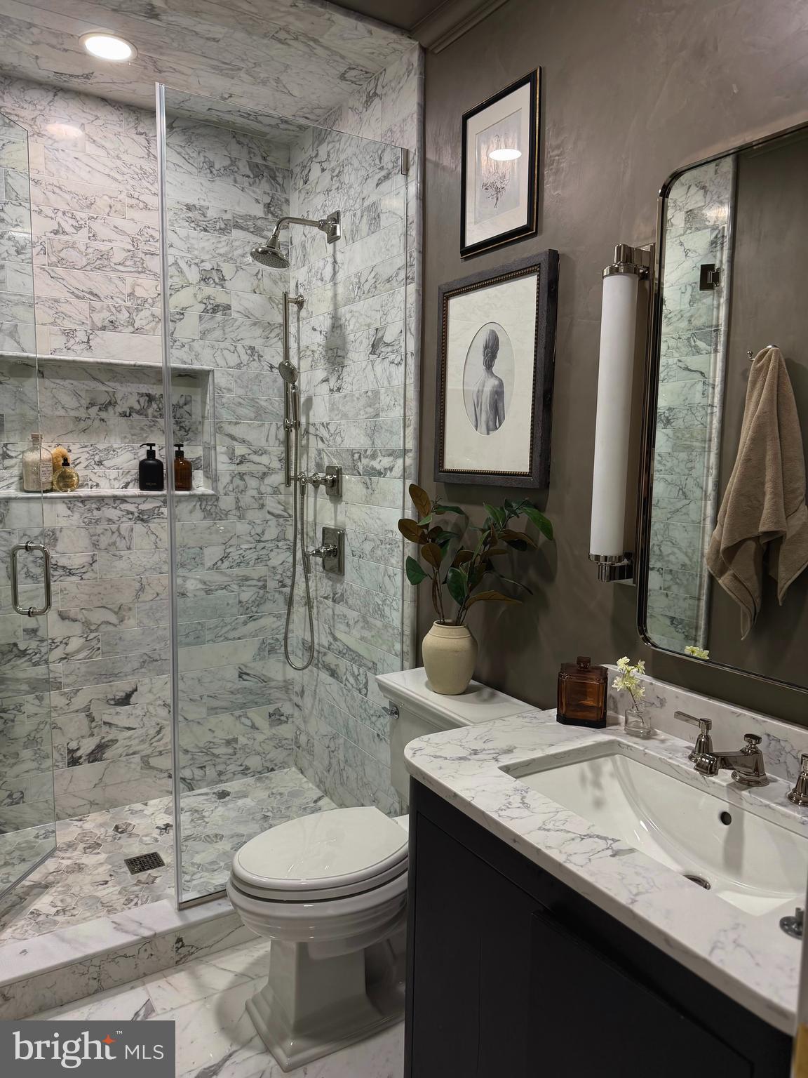1203 T Street Northwest Washington, DC 20009 - Photo 29 of 46 a bathroom with a toilet sink and mirror