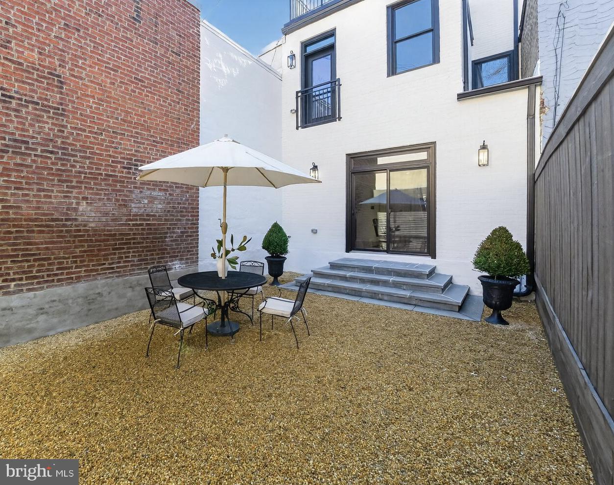 1203 T Street Northwest Washington, DC 20009 - Photo 46 of 46 a view of a house with patio and a fire pit