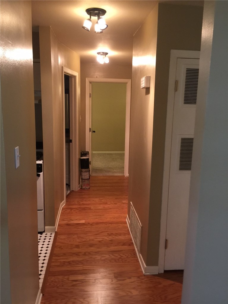 2516 Enfield Road, Unit 201 Austin, TX 78703 - Photo 6 of 11 a view of a hallway with wooden floor