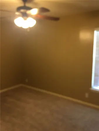 a kitchen with a stove and a refrigerator