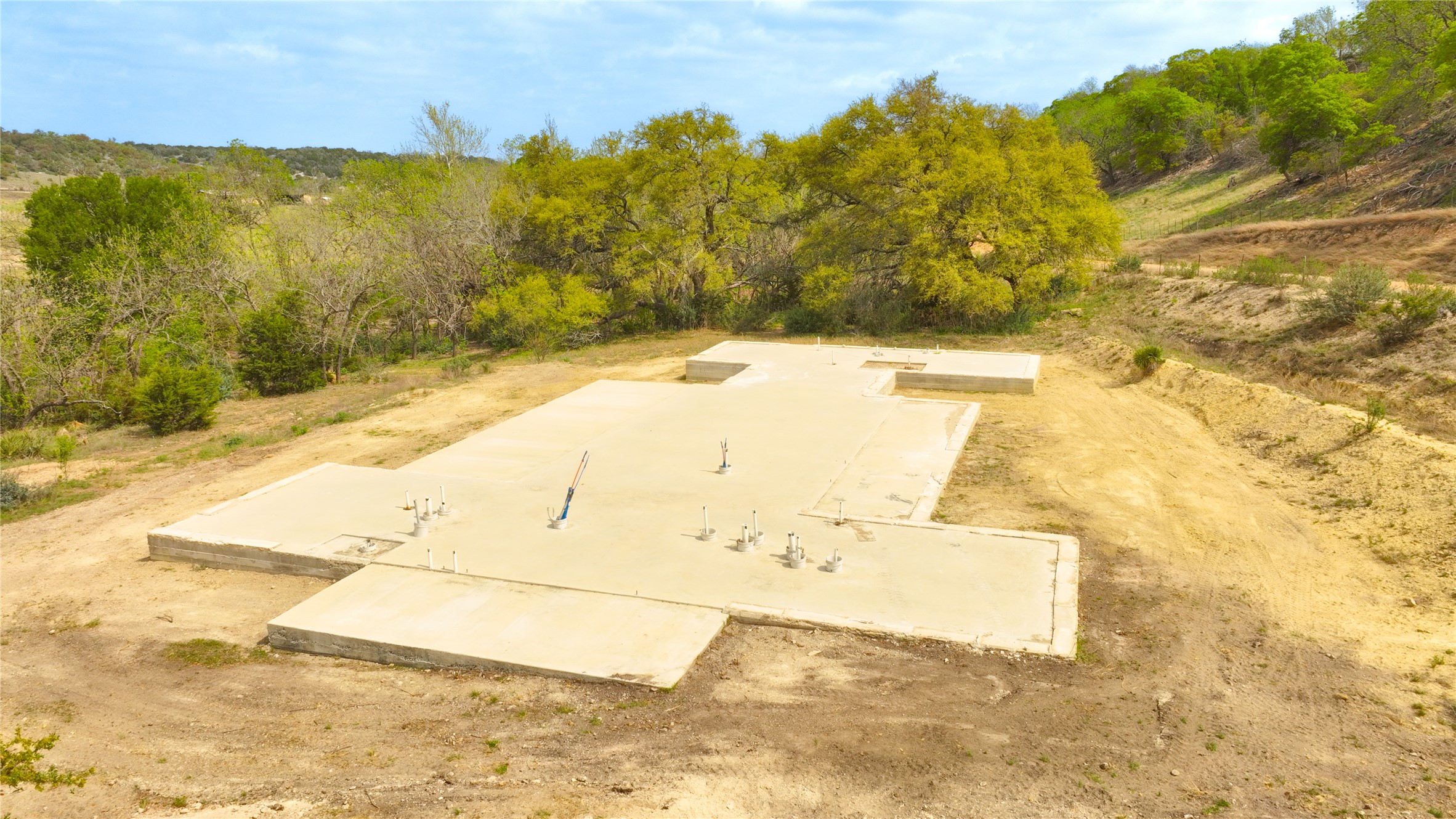 6980 Doss-Spring Creek Road Fredericksburg, TX 78624 - Photo 11 of 20 View of foundation that has been poured for construction of future residence. Construction Plans are Available.