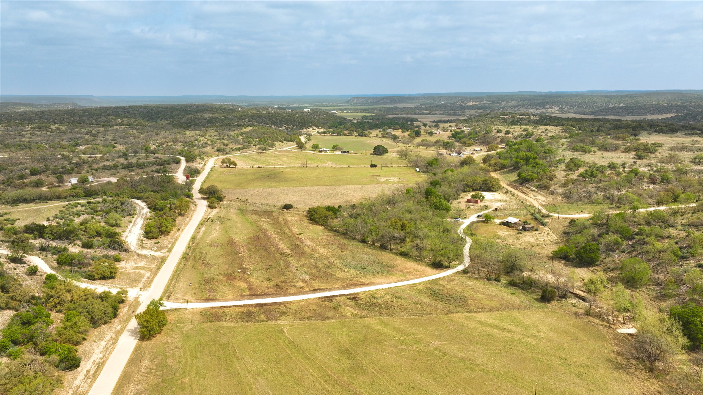 6980 Doss-Spring Creek Road Fredericksburg, TX 78624 - Photo 2 of 20 Aerial view of property showing surrounding Hill Country Views.