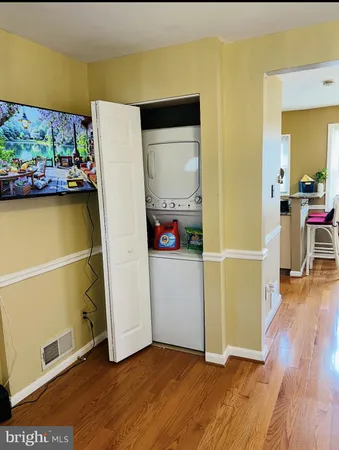 a view of a room with wooden floor