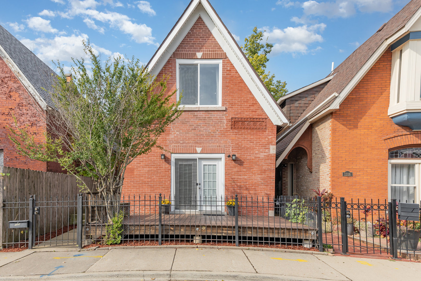 1320 South Heath Avenue Chicago, IL 60608 - Photo 1 of 1 a front view of a house with a yard