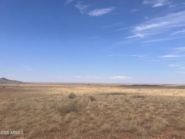 a view of a room with furniture and a window
