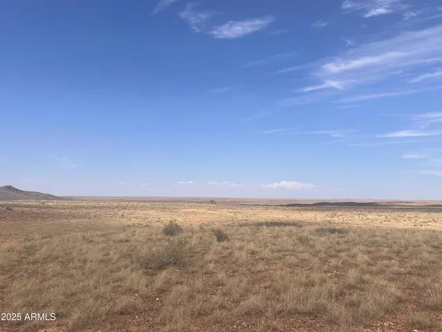 a view of a room with furniture and a window