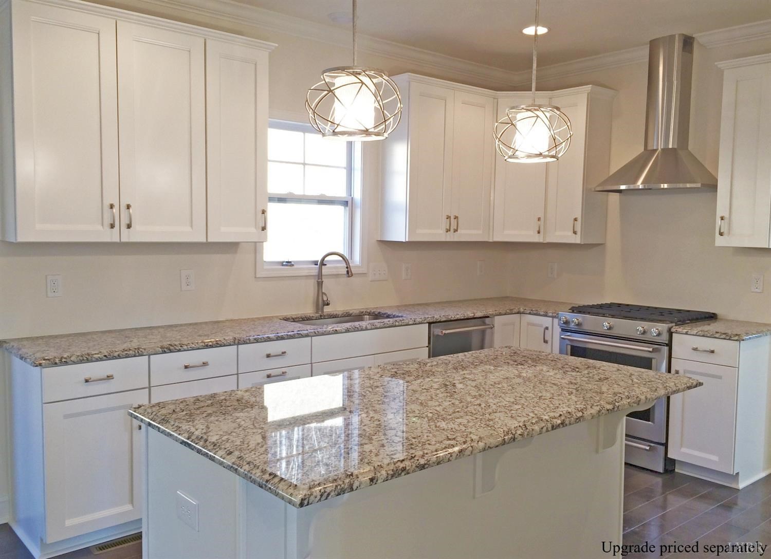 291 Crystal Lane Evington, VA 24550 - Photo 8 of 16 a kitchen with granite countertop a sink a stove and cabinets
