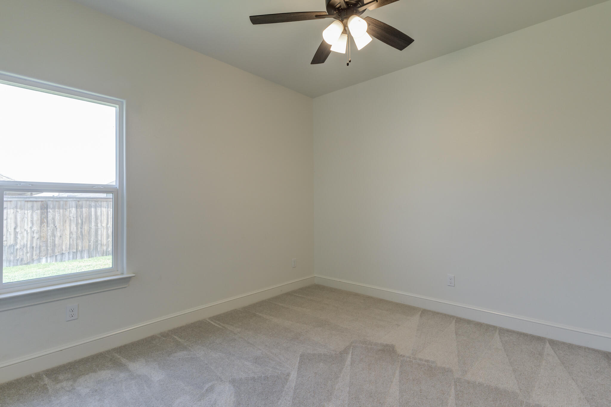5720 119th Street Lubbock, TX 79424 - Photo 11 of 43 an empty room with a window