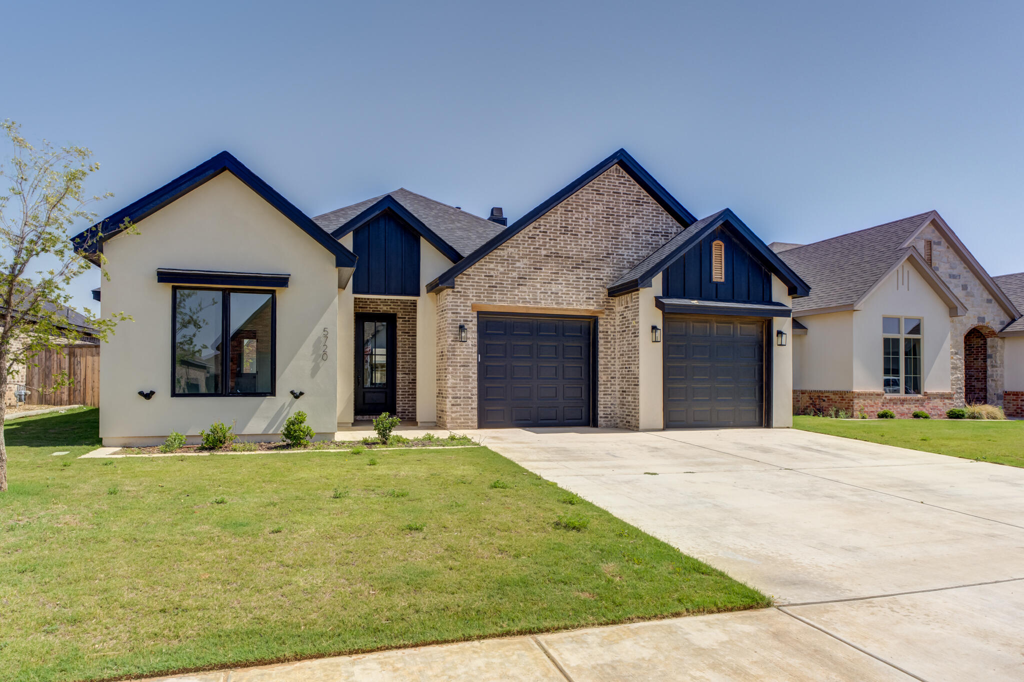 5720 119th Street Lubbock, TX 79424 - Photo 2 of 43 a front view of a house with a yard
