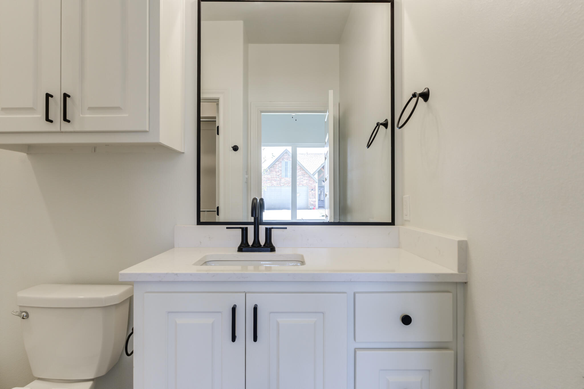 5720 119th Street Lubbock, TX 79424 - Photo 7 of 43 a bathroom with a sink toilet and mirror