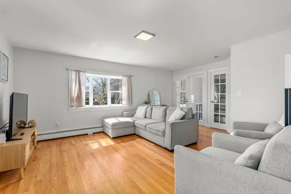 a living room with furniture and a window