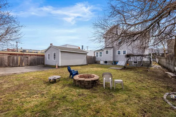 a swimming pool with yard and outdoor seating