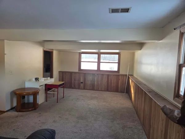 a living room with furniture and window