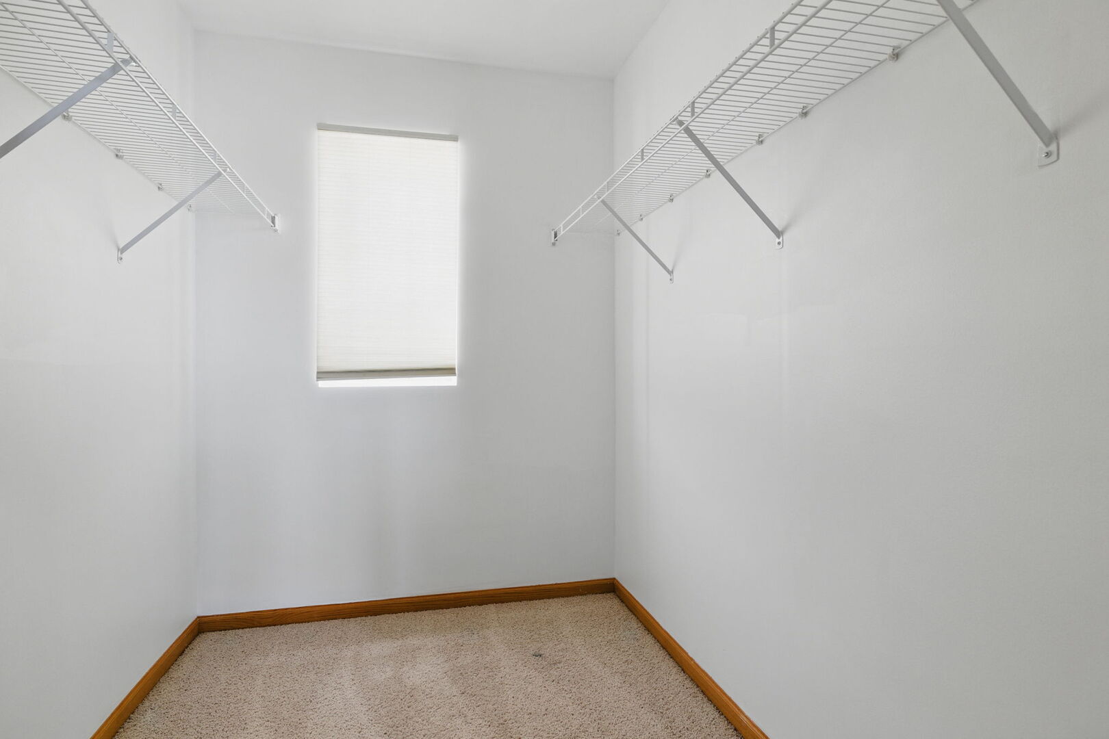 15340 Kenmare Circle Manhattan, IL 60442 - Photo 13 of 19 a view of a small room with racks on the wall