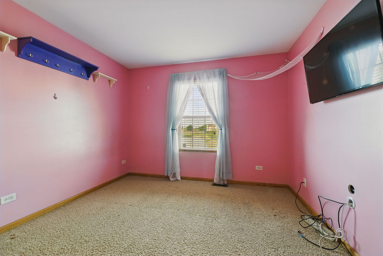 15340 Kenmare Circle Manhattan, IL 60442 - Photo 15 of 19 a room with window and a flat screen tv