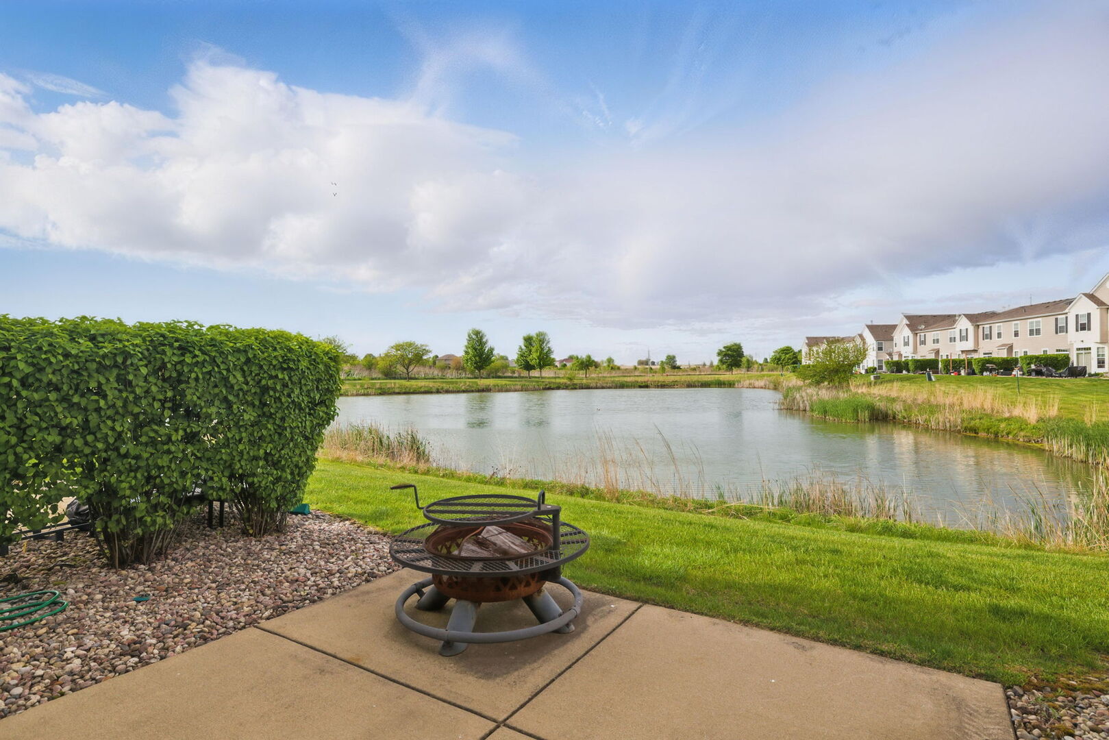 15340 Kenmare Circle Manhattan, IL 60442 - Photo 18 of 19 a swimming pool with outdoor seating and barbeque oven